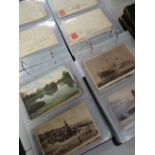 Two albums of neatly presented vintage postcards, one album mainly being British topographical