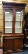 An antique mahogany bookcase cupboard of narrow proportions, 203hx91wx34dcms. Condition Report: