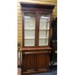 An antique mahogany bookcase cupboard of narrow proportions, 203hx91wx34dcms. Condition Report: