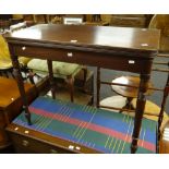 An antique foldover tea table on turned legs (A/F), 91wx45dx75hcms. Condition Report: please request