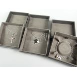 Three boxed Clogau gold jewellery items comprising Clogau Glyn Rhosyn Cross pendant (RRP £159), a