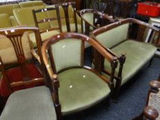 An Edwardian salon suite comprising two-seater sofa, pair of tub chairs & a pair of side chairs
