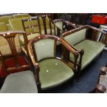 An Edwardian salon suite comprising two-seater sofa, pair of tub chairs & a pair of side chairs