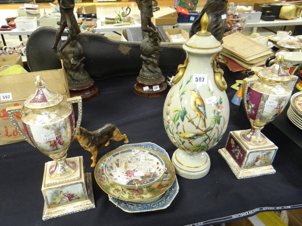 A pair of Austrian pedestal lidded vases with twin handles, a milk glass painted twin-handled