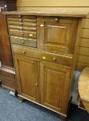 A vintage oak dentistry cabinet & contents composed of two base cupboards, long single drawer &