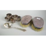 A pair of machine turned silver backed clothes brushes, six silver napkin rings ETC Condition