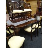 An antique mahogany extending dining table, 237x120wx75hcms, with winding mechanism (winder with