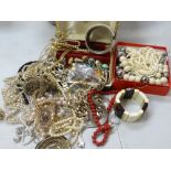 A tub of costume jewellery & beads Condition Report: please request via email. Condition reports not