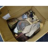 A parcel of twentieth century military items including ARP tin-hat, gas masks, old tins ETC