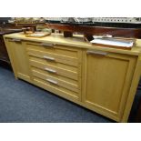 A modern oak sideboard composed of four centre drawers & flanking cupboards, 210cms wide Condition