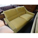 A retro circa 1960s / 70s two-seater mustard upholstered sofa by Howard Keith Condition Report: