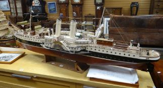 A substantial motorised model of a paddle steamer named Lady Jatolyn, 142cms long on wooden stand (