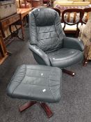 A modern green leather swivel armchair & matching foot stool Condition Report: please request via