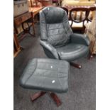 A modern green leather swivel armchair & matching foot stool Condition Report: please request via