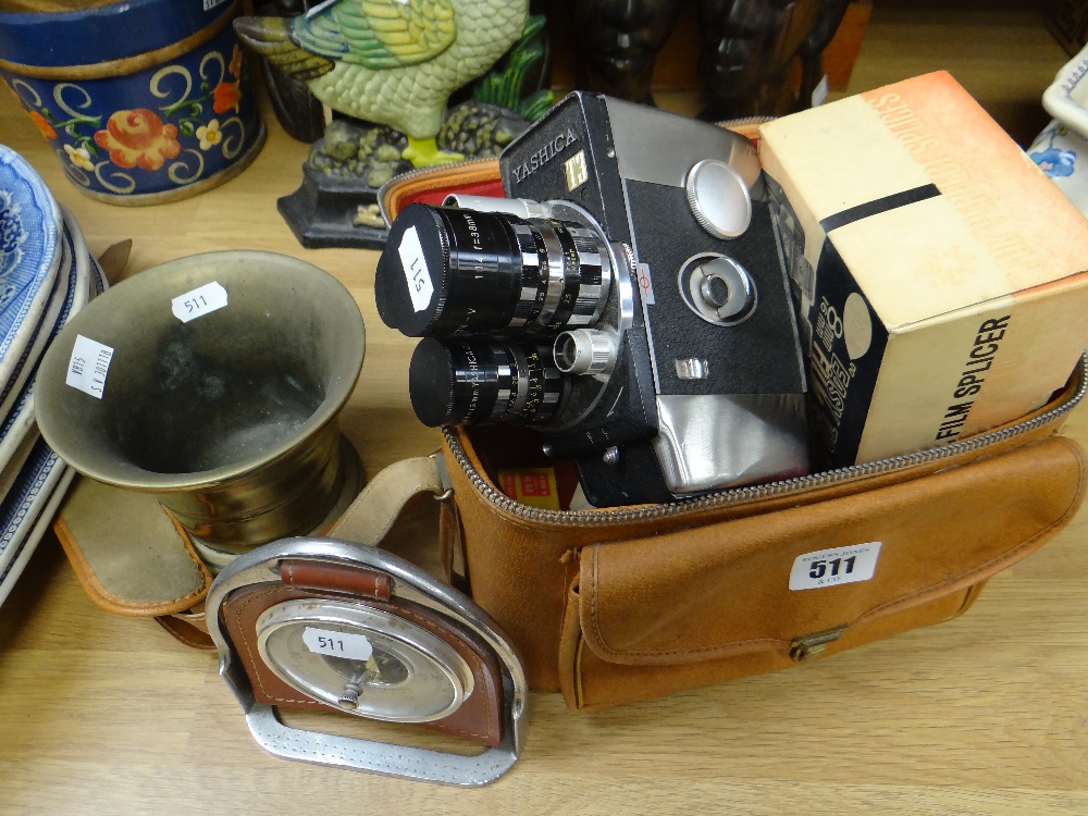 A Yashica T3 camera, a brass mortar & a novelty equestrian stirrup suspended desk-barometer