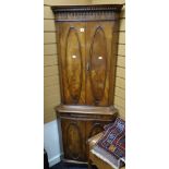 A good quality reproduction mahogany finish standing corner cupboard with mirrored brushing slide