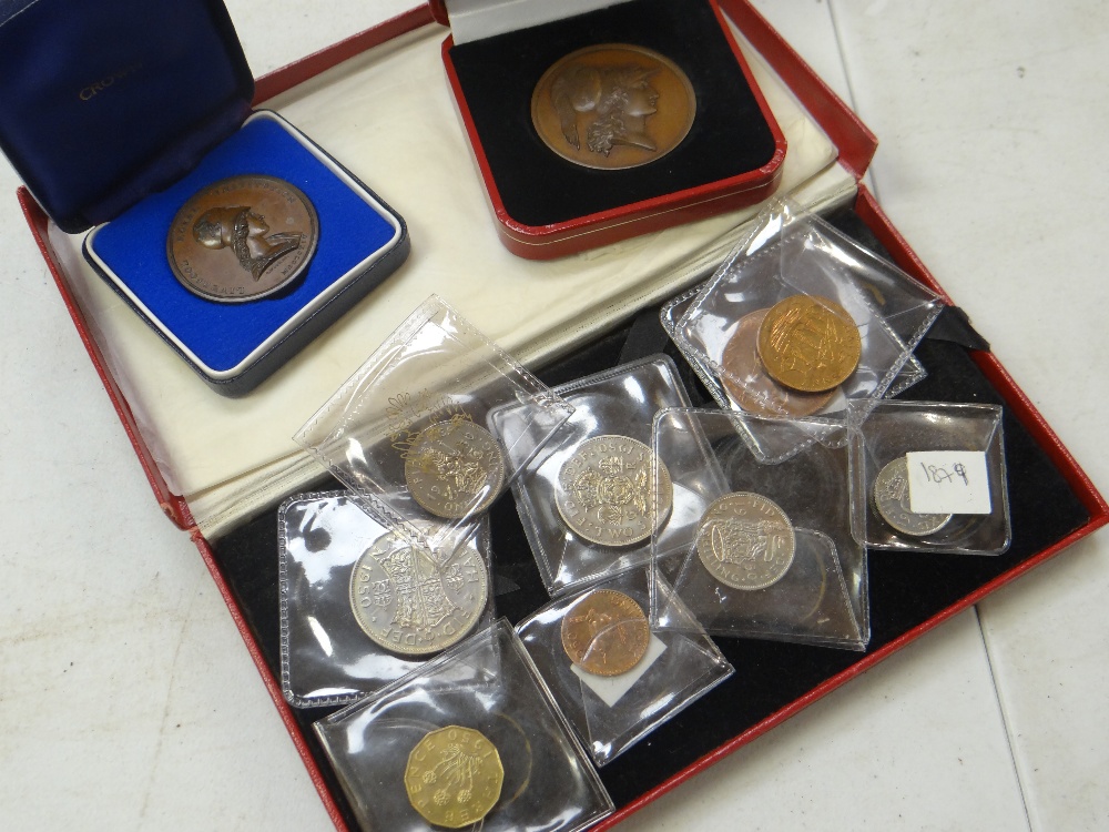 A boxed 1950 British proof coin set in Royal Mint box, a cased Pobjoy Mint medallion & another