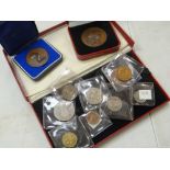 A boxed 1950 British proof coin set in Royal Mint box, a cased Pobjoy Mint medallion & another