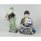 JAPANESE PORCELAIN STUDY OF A SEATED MEDITATING FEMALE in geometric & stylized blue robes,