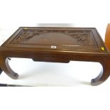 20th CENTURY CARVED HARDWOOD RECTANGULAR COFFEE TABLE overall carved in Oriental-style, depicting