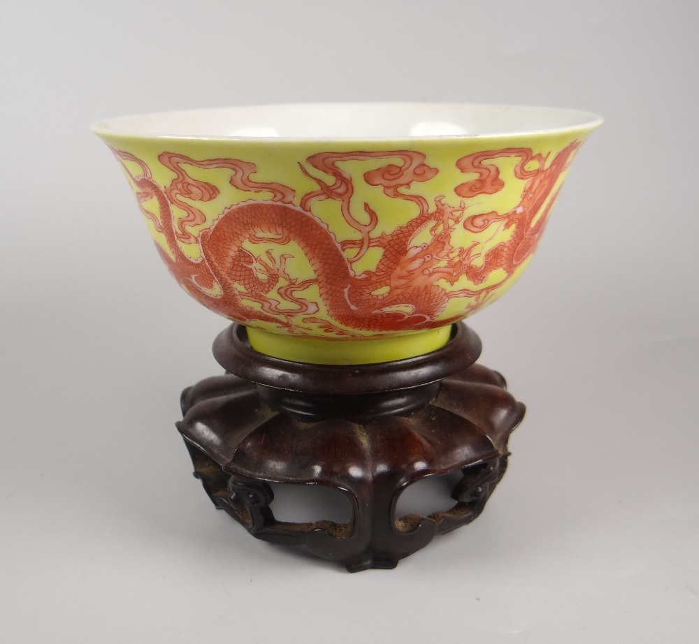 CHINESE PORCELAIN SMALL CIRCULAR BOWL RAISED ON CIRCULAR FOOT the exterior of the bowl in yellow &