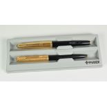 A VINTAGE BLACK PARKER 65 CUSTOM INSIGNIA FOUNTAIN PEN & BALLPOINT PEN SET with 12ct rolled gold