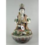 JAPANESE PORCELAIN FIGURE of a female seated with sword on lotus leaf base, possibly a seated