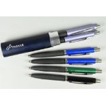 FOUR MODERN PARKER REFLEX BALLPOINT PENS one black, one green, two blue together with a metallic