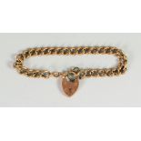 9CT GOLD CURB LINK BRACELET with heart shaped padlock, 11.3 grams approx. Condition Report: hinge on