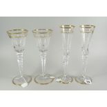 TWO PAIRS OF ST. LOUIS FRANCE CUT CRYSTAL GLASSES to include pair of champagne flutes & a pair of