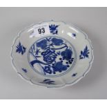 CHINESE PORCELAIN SMALL BLUE & WHITE SHALLOW DISH raised on circular foot, decorated with pine tree,