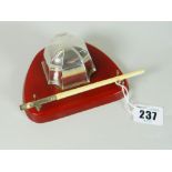 GEORGE V SILVER TABLE TOP DESK/PEN STAND raised on possibly red bakelite stand with clear glass