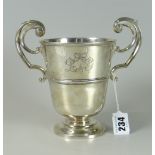 EDWARD VII SILVER PEDESTAL TROPHY CUP having twin scroll whiplash handles with engraved initials "