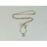 9CT YELLOW GOLD BOW DESIGN PENDANT with seven stone diamond drop on 9ct yellow gold flat curb link