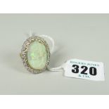 18CT GOLD LARGE CARVED OPAL & DIAMOND OVAL RING the carved opal depicting head & shoulders of a