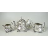VICTORIAN SILVER THREE PIECE TEA SET, comprising teapot, sucrier and cream jug overall repousse