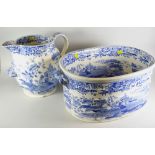 LARGE 19th CENTURY POTTERY TRANSFER PRINTED BLUE & WHITE JUG AND TWIN-HANDLED OVAL FOOT BATH,