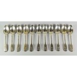 SET OF ELEVEN VICTORIAN SILVER FIDDLE PATTERN DESSERT SPOONS, with engraved initial "W". London