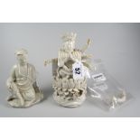 TWO CHINESE BLANC DE CHINE FIGURES one depicting a Deity praying with many arms together with