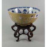 CHINESE PORCELAIN PEDESTAL BOWL the interior in blue & white design, the exterior in pale brown