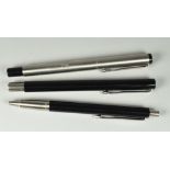 THREE MODERN PARKER VECTOR PENS including one stainless steel rollerball pen (engraved '