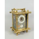 EARLY TWENTIETH CENTURY BRASS BAMBOO DESIGN CARRIAGE CLOCK the front & side panels decorated with