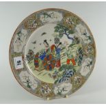 CHINESE PORCELAIN FAMILLE VERTE PLATE depicting figures in a garden landscape within bird