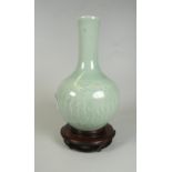 CHINESE CELADON GLAZED ONION SHAPED VASE depicting fantastical winged creature, unmarked, 18cms high