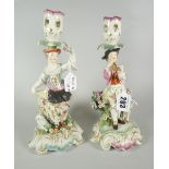 PAIR OF 19th CENTURY PORCELAIN FIGURAL CANDLESTICKS depicting male & female with flowers & animals