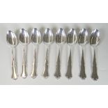 SET OF EIGHT NORWEGIAN SILVER SPOONS of shell and scroll design. Hallmarked "830 S" with further