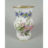 A FINE FRENCH PORCELAIN BELLIED VASE painted with a continuous trail of flowers and two large