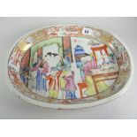 CHINESE EXPORT PORCELAIN FAMILLE ROSE OVAL SERVING DISH depicting figures in an interior scene