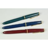 THREE VINTAGE PARKER SLIMFOLD FOUNTAIN PENS each with an original 14ct gold nib (blue, green & red)