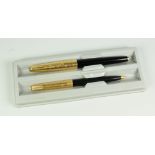 A VINTAGE BLACK PARKER 65 CONSORT INSIGNIA FOUNTAIN PEN & PENCIL SET with 12ct rolled gold caps,